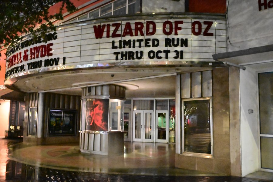 A side view of the theater marquee and doors